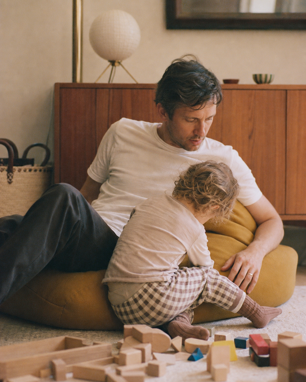 A dad smiling with his child