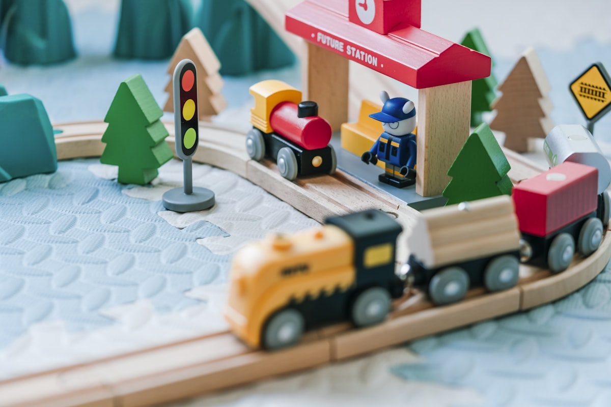 A toddler playing with wooden blocks on a rug